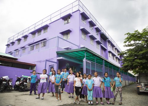 Purple school with students